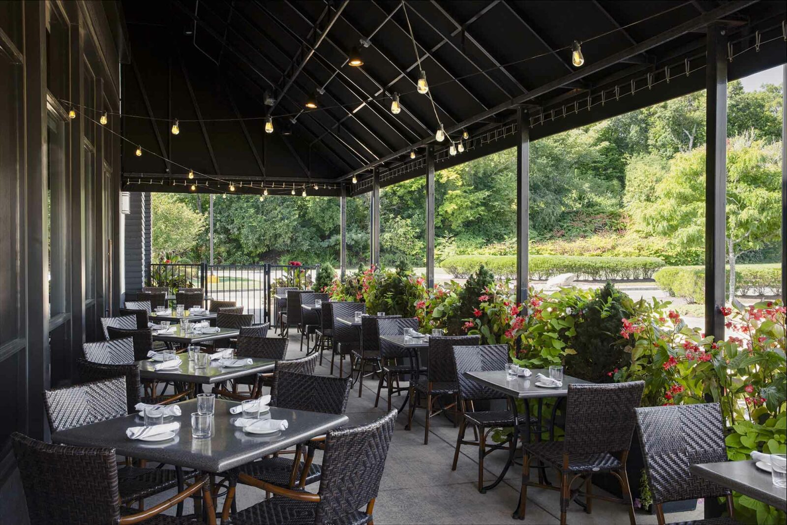 View of patio tables at Burtons Grill in Burlington, MA.