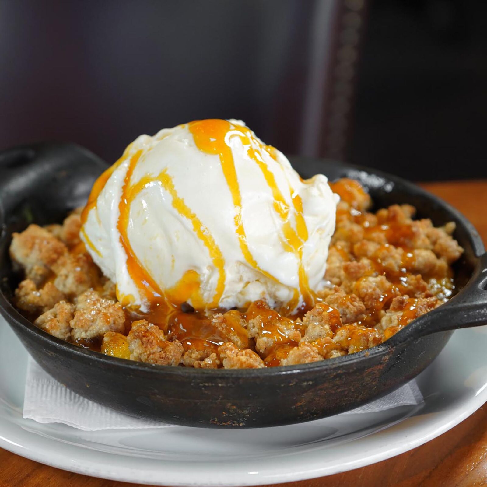 Peach cobbler with vanilla ice cream.